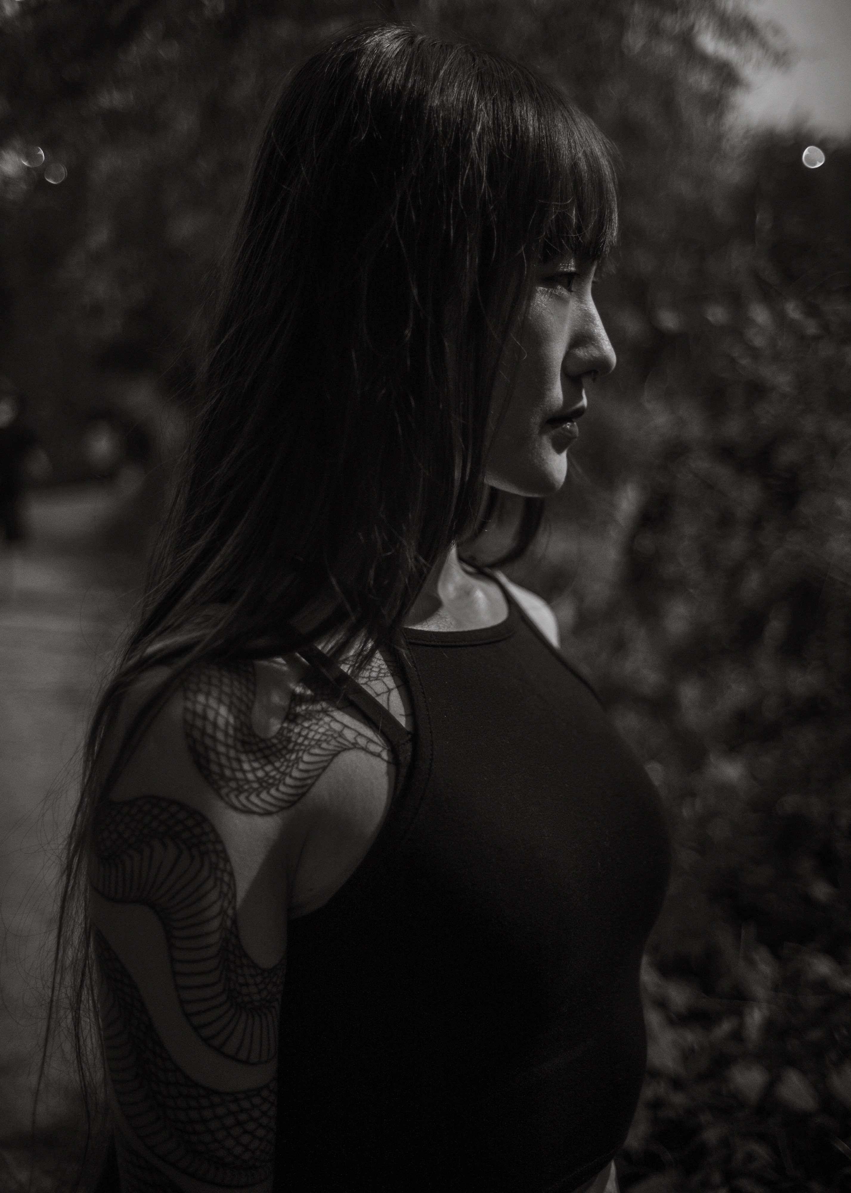 Saemi, a quiet portrait in profile, in the dark